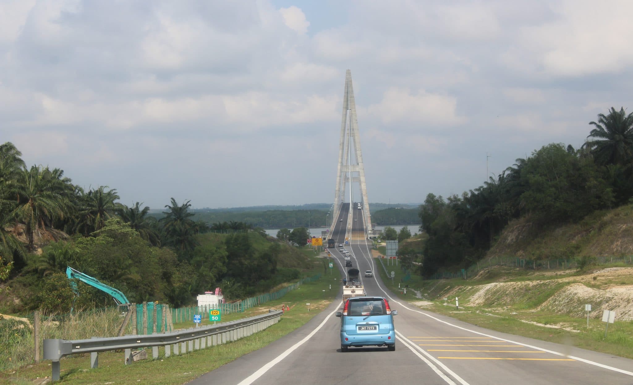 A car on the Senai–Desaru Expressway approaching the Sungai Johor cable-stayed bridge